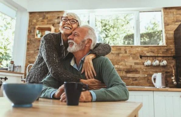 Cuddling couple Excited aged married couple cuddling