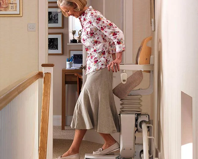 the right stairlift if sitting down is a problem A Curved stairlift for stairs that turn
